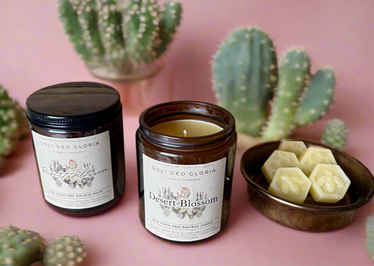 Candle and wax melts in a pink desert themed room.